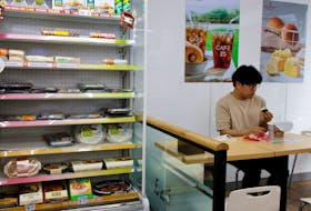 An office worker eats his lunch at a convenience store in Seoul, South Korea, June 24, 2022. Picture taken June 24, 2022. 
