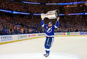 Jul 7, 2021; Tampa, Florida, USA; Tampa Bay Lightning center Steven Stamkos (91) hoists the Stanley Cup after the 1-0 victory against the Montreal Canadiens in game five of the 2021 Stanley Cup Final at Amalie Arena. Mandatory Credit: Bruce Bennett/Pool Photo-USA TODAY Sports