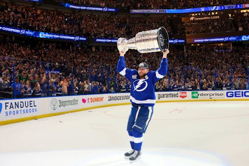 Jul 7, 2021; Tampa, Florida, USA; Tampa Bay Lightning center Steven Stamkos (91) hoists the Stanley Cup after the 1-0 victory against the Montreal Canadiens in game five of the 2021 Stanley Cup Final at Amalie Arena. Mandatory Credit: Bruce Bennett/Pool Photo-USA TODAY Sports