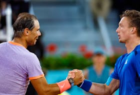 Tennis - Madrid Open - Park Manzanares, Madrid, Spain - April 30, 2024 Czech Republic's Jiri Lehecka shakes hands with Spain's Rafael Nadal after winning their round of 16 match