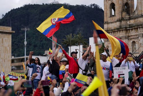 Supporters of Colombia's President Gustavo Petro attend a march in support of the reforms on health, retirement, employment, and prisons sectors proposed by his government, in Bogota, Colombia May 1, 2024.