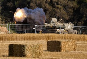 An Israeli mobile artillery unit fires towards Gaza, amid the ongoing conflict between Israel and the Palestinian Islamist group Hamas, near the Israel-Gaza border, in Israel, April 30, 2024.