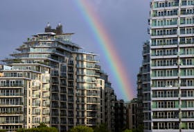 A rainbow is seen over apartments in Wandsworth on the River Thames as UK house prices continue to fall, in London, Britain, August 26, 2023.  