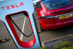 A Tesla car is charged at a Tesla dealership in West Drayton, just outside London, Britain, February 7, 2018.