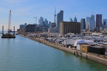 The downtown skyline and CN Tower are seen past the eastern waterfront area envisioned by Alphabet Inc's Sidewalk Labs as a new technical hub in the Port Lands district of Toronto, Ontario, Canada April 3, 2019. 