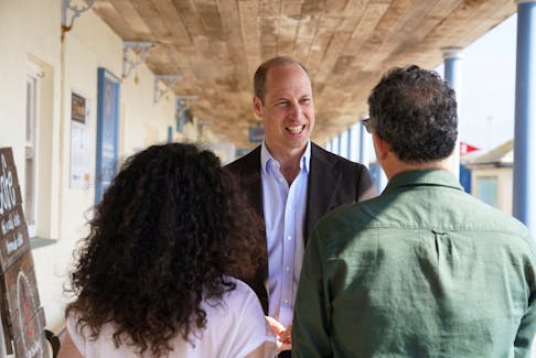 Britain's Prince William, Prince of Wales, known as the Duke of Cornwall when in Cornwall, reacts during a visit to St. Mary's Harbour, the maritime gateway to the Isles of Scilly, to meet representatives from local businesses operating in the area, Isles of Scilly, May 10, 2024. Ben Birchall/Pool via