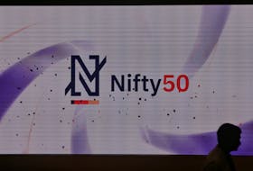 A man walks past a new brand identity for Nifty Indices inside the National Stock Exchange (NSE) building in Mumbai, India, May 28, 2019.