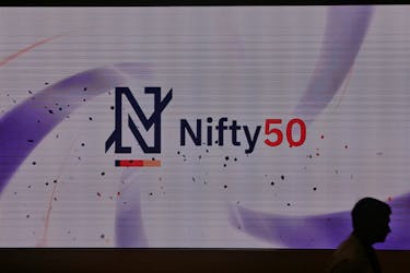 A man walks past a new brand identity for Nifty Indices inside the National Stock Exchange (NSE) building in Mumbai, India, May 28, 2019.