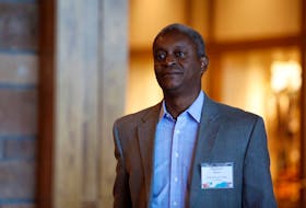 Atlanta Federal Reserve President Raphael Bostic walks into a conference in Jackson Hole, Wyoming, U.S., August 23, 2019.