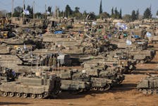 Israeli military vehicles are seen near the Israel-Gaza Border, amid the ongoing conflict between Israel and the Palestinian Islamist group Hamas, in southern Israel, May 9, 2024.