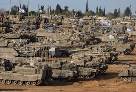 Israeli military vehicles are seen near the Israel-Gaza Border, amid the ongoing conflict between Israel and the Palestinian Islamist group Hamas, in southern Israel, May 9, 2024.