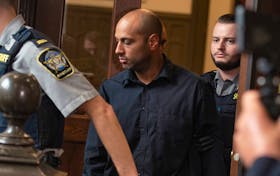 Alexander Pishori Levy, a former bouncer at the Halifax Alehouse, is led out of Halifax provincial court Wednesday, Aug. 16, 2023, after his arraignment on charges of manslaughter and criminal negligence causing the death of Ryan Sawyer last December. Levy, 38. was released on bail with the Crown's consent. 
Ryan Taplin - The Chronicle Herald