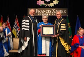 Pictured left to right during St. Francis Xavier University’s recent graduation ceremonies are university president Andy Hakin, Elder Sister Dorothy Moore and university chancellor John Peacock. Moore was awarded a degree Doctor of Laws honoris causa for her work as an activist and educator. CONTRIBUTED
