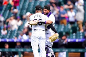 May 9, 2024; Denver, Colorado, USA; Colorado Rockies relief pitcher Jalen Beeks (68) and catcher Elias Díaz celebrate defeating the San Francisco Giants at Coors Field. Mandatory Credit: Ron Chenoy-USA TODAY Sports