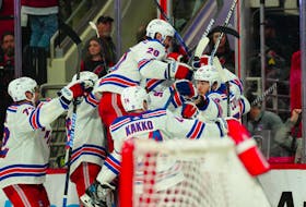 May 9, 2024; Raleigh, North Carolina, USA; New York Rangers left wing Artemi Panarin (10) is congratulated by his teammates after his goal in the first overtime against the Carolina Hurricanes in game three of the second round of the 2024 Stanley Cup Playoffs at PNC Arena. Mandatory Credit: James Guillory-USA TODAY Sports