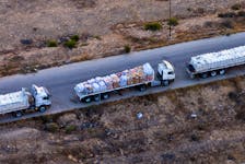A drone picture of part of a line of trucks waiting on an Egyptian road along the border with Israel, near the Rafah border crossing with the Gaza Strip May 2, 2024.