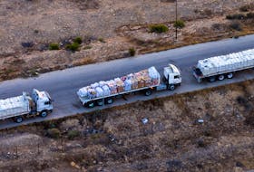 A drone picture of part of a line of trucks waiting on an Egyptian road along the border with Israel, near the Rafah border crossing with the Gaza Strip May 2, 2024.