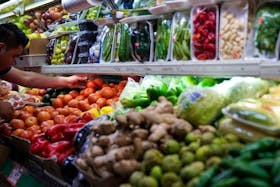 A person arranges groceries in El Progreso Market in the Mount Pleasant neighborhood of Washington, D.C., U.S., August 19, 2022.