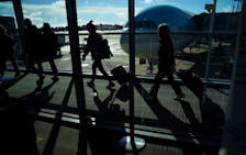 Passengers make their way through the terminal as they travel ahead of the Thanksgiving holiday at Washington Dulles International Airport in Dulles, Virginia, U.S., November 22, 2023.