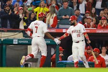 May 10, 2024; Anaheim, California, USA; Los Angeles Angels outfielder Jo Adell (7) is greeted by second base Luis Guillorme (15) after hitting a home run during the fifth inning against the Kansas City Royals at Angel Stadium. Mandatory Credit: Kiyoshi Mio-USA TODAY Sports