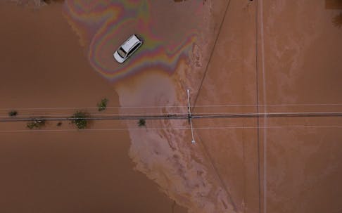 A drone view shows a car on a flooded street in Eldorado do Sul, Rio Grande do Sul state, Brazil, May 10, 2024.