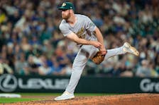 May 10, 2024; Seattle, Washington, USA; Oakland Athletics reliever Michael Kelly (47) delivers a pitch during the seventh inning against the Seattle Mariners at T-Mobile Park. Mandatory Credit: Stephen Brashear-USA TODAY Sports