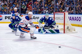 May 10, 2024; Vancouver, British Columbia, CAN; Edmonton Oilers forward Connor McDavid (97) skates after the loose puck against the Vancouver Canucks during the second period in game two of the second round of the 2024 Stanley Cup Playoffs at Rogers Arena. Mandatory Credit: Bob Frid-USA TODAY Sports