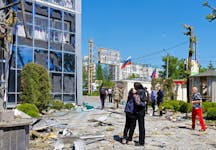 People gather outside a restaurant building hit by recent shelling, which local Russian-installed authorities called a Ukrainian military strike, in the course of Russia-Ukraine conflict in Donetsk, Russian-controlled Ukraine, May 11, 2024.