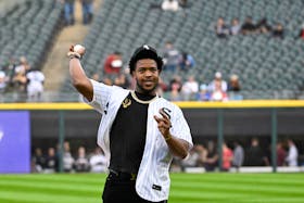 May 10, 2024; Chicago, Illinois, USA; Chicago BearsÕ player DeMarcus Walker throws out a ceremonial first pitch before the game between the Chicago White Sox and the Cleveland Guardians at Guaranteed Rate Field. Mandatory Credit: Matt Marton-USA TODAY Sports