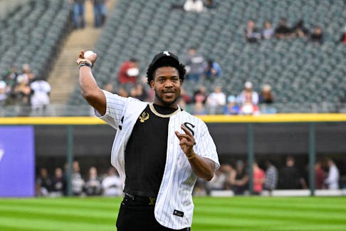 May 10, 2024; Chicago, Illinois, USA; Chicago BearsÕ player DeMarcus Walker throws out a ceremonial first pitch before the game between the Chicago White Sox and the Cleveland Guardians at Guaranteed Rate Field. Mandatory Credit: Matt Marton-USA TODAY Sports