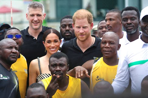 Britain's Prince Harry, Duke of Sussex and his wife Meghan, Duchess of Sussex pose on the day they attend a volleyball match played with wounded army veterans, at the Nigerian army officers' mess in Abuja, Nigeria May 11, 2024.