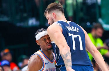 May 11, 2024; Dallas, Texas, USA; Oklahoma City Thunder guard Shai Gilgeous-Alexander (2) runs into Dallas Mavericks guard Luka Doncic (77) during the first half during game three of the second round for the 2024 NBA playoffs at American Airlines Center. Mandatory Credit: Kevin Jairaj-USA TODAY Sports