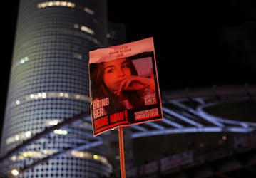 A person holds a placard as people attend a protest against Israeli Prime Minister Benjamin Netanyahu's government, amid the ongoing conflict in Gaza between Israel and the Palestinian Islamist group Hamas, in Tel Aviv, Israel, May 11, 2024.