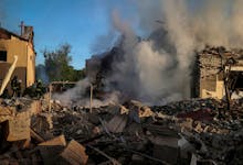 Firefighters work at a site of a Russian missile strike, amid Russia's attack on Ukraine, in Kharkiv, Ukraine May 10, 2024.