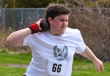 In this file photo, Max Minihan prepares for the shot put during a previous Cape Breton-Victoria district track and field meet in Sydney. Minihan will once again take part in the event on Monday in Sydney. CONTRIBUTED/OWEN FITZGERALD
