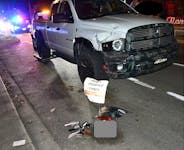 RCMP in Victoria investigate an alleged impaired driver after an F350 pickup truck crashed into a street sign that said 'report impaired drivers' on March 22.