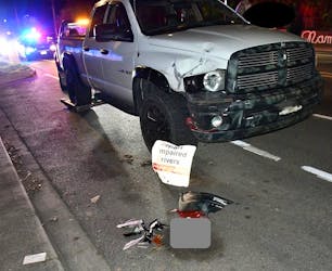 RCMP in Victoria investigate an alleged impaired driver after an F350 pickup truck crashed into a street sign that said 'report impaired drivers' on March 22.