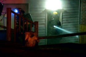 One man was treated by paramedics following a house fire in St. John's early Sunday morning. Keith Gosse/The Telegram