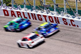 May 12, 2024; Darlington, South Carolina, USA; The field goes through turns one and two during the Goodyear 400 at Darlington Raceway. Mandatory Credit: Peter Casey-USA TODAY Sports