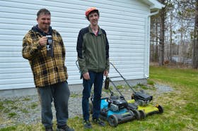 Wayne Morash, left, and Ian Currie, both Breton Ability Centre residents in Sydney River, have formed a small  landscaping company, WI Landscaping. BARB SWEET/CAPE BRETON POST