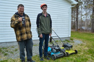 Wayne Morash, left, and Ian Currie, both Breton Ability Centre residents in Sydney River, have formed a small  landscaping company, WI Landscaping. BARB SWEET/CAPE BRETON POST