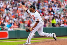May 12, 2024; Baltimore, Maryland, USA; Baltimore Orioles pitcher Albert Suarez (49) delivers a pitch against the Arizona Diamondbacks during the seventh inning at Oriole Park at Camden Yards. Mandatory Credit: Gregory Fisher-USA TODAY Sports