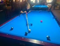 Lynn Gould of the Aunties team uses the rake to line up a shot at the 10-ball during the April Denny Memorial Tournament at Dooly’s pool and billiard hall in Sydney on Sunday. Teams and individual players from across the Maritimes took part in the weekend-long event in memory of Denny, a 19-year-old Eskasoni pool enthusiast who died suddenly of heart failure. CHRIS CONNORS/CAPE BRETON POST