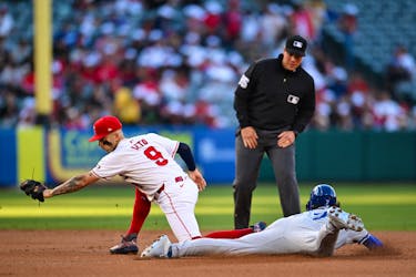 May 11, 2024; Anaheim, California, USA; Kansas City Royals shortstop Bobby Witt Jr. (7) steals second base against the Los Angeles Angels shortstop Zach Neto (9) during the first inning at Angel Stadium. Mandatory Credit: Jonathan Hui-USA TODAY Sports