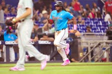 May 12, 2024; Miami, Florida, USA; Miami Marlins first base Josh Bell (9) scores a run in the second inning against the Philadelphia Phillies at loanDepot Park. Mandatory Credit: Jim Rassol-USA TODAY Sports