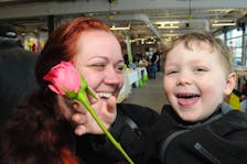 The St. John’s Farmer’s Market on Freshwater Road held a special Mother’s Day humpday market on Mother’s Day, Sunday, May 12, 2024, for folks looking for that extra special gift for their mom. And for this mom and son from Mount Pearl, three-year-old Owen Vinicombe is all smiles and full of delight as he gives “mommy a flower” at the market. Mom Monica Butler is cherished with her red rose too from Owen to take home and later enjoy her Mother’s Day supper cooked by hubby Justin Vinicombe. -Photo by Joe Gibbons/The Telegram