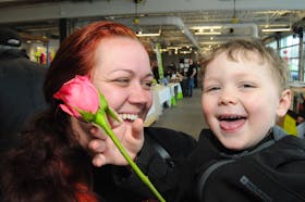 The St. John’s Farmer’s Market on Freshwater Road held a special Mother’s Day humpday market on Mother’s Day, Sunday, May 12, 2024, for folks looking for that extra special gift for their mom. And for this mom and son from Mount Pearl, three-year-old Owen Vinicombe is all smiles and full of delight as he gives “mommy a flower” at the market. Mom Monica Butler is cherished with her red rose too from Owen to take home and later enjoy her Mother’s Day supper cooked by hubby Justin Vinicombe. -Photo by Joe Gibbons/The Telegram