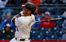 May 11, 2024; Pittsburgh, Pennsylvania, USA; Pittsburgh Pirates catcher Yasmani Grandal (6) hits a three run home run against the Chicago Cubs during the fifth inning at PNC Park. Mandatory Credit: Charles LeClaire-USA TODAY Sports