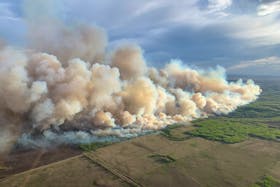 Smoke rises from mutual aid wildfire GCU007 in the Grande Prairie Forest Area near TeePee Creek, Alberta, Canada May 10, 2024. Alberta Wildfire/Handout via