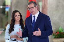 Serbian President Aleksandar Vucic with his wife Tamara Vucic speaks ahead of welcome ceremony for Chinese President Xi Jinping's during Xi's two-day state visit in Belgrade, Serbia, May 8, 2024.